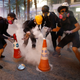 Wisdom of the youth: extinguishing tear gas canisters with roadblock cones.